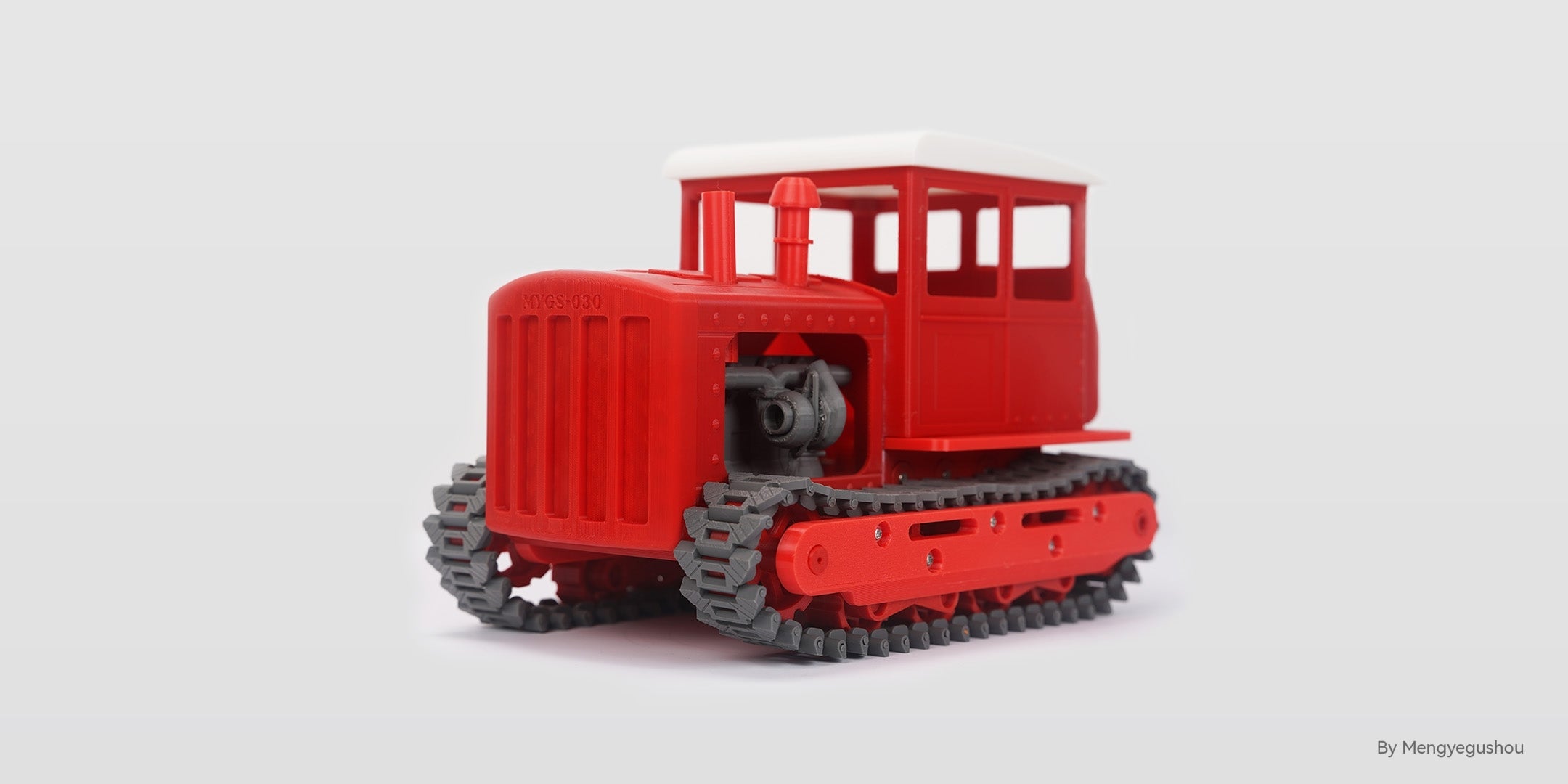A Red And Grey 3D Printed Tractor Model