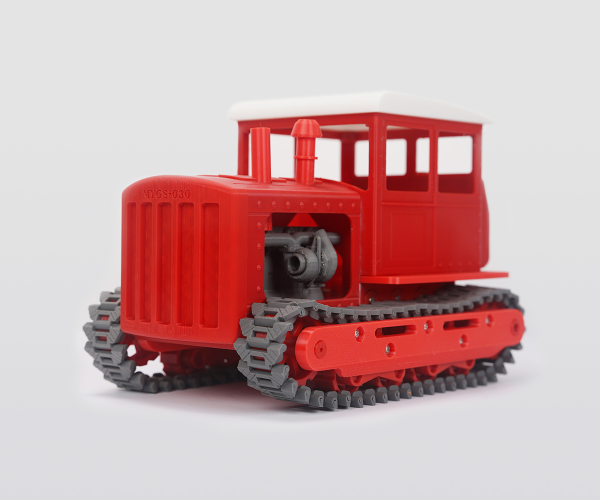 A Red And Grey 3D Printed Tractor Model